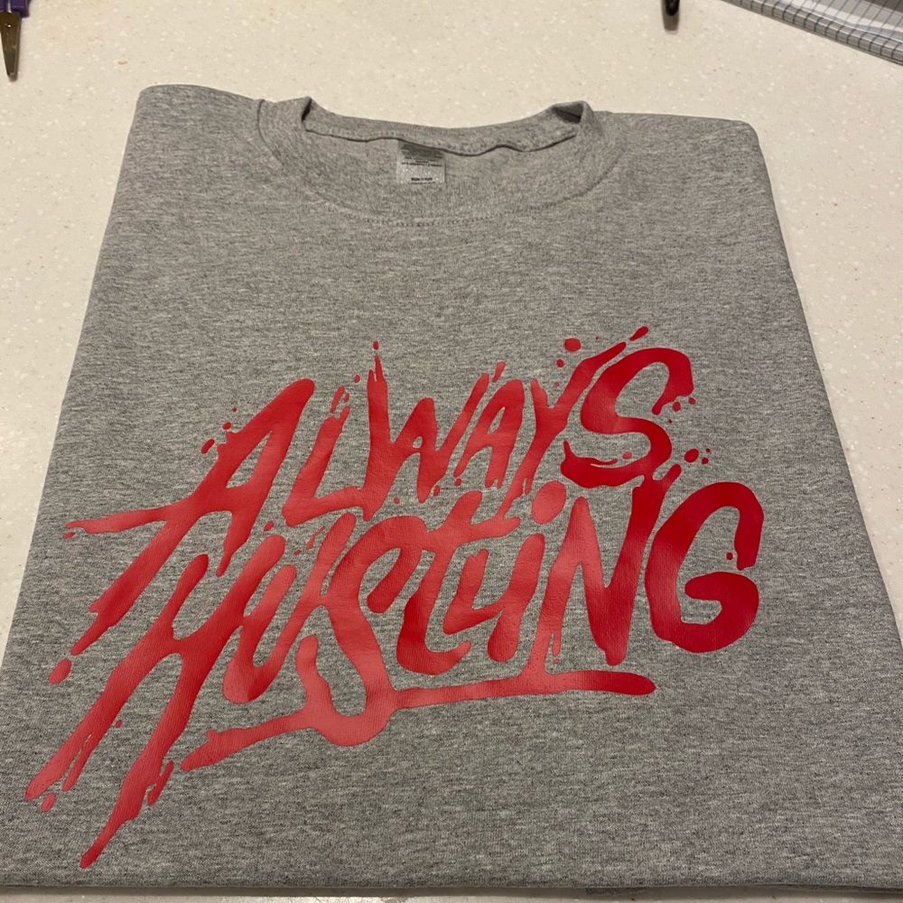 “Always hustling “ brand new tee.